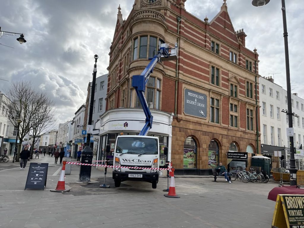 Cleaning windows with cherry picker